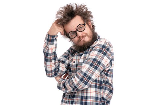 Crazy thoughtful bearded Man with funny Haircut in eye Glasses - ponder and dreaming. Casual thinking guy in plaid shirt, isolated on white background. Emotions, and signs concept.