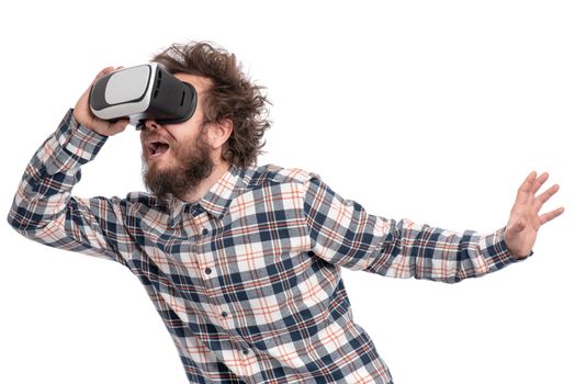 Crazy bearded Man in plaid shirt with funny Haircut wearing virtual reality helmet, isolated on white background. Portrait of funny man using VR goggles.