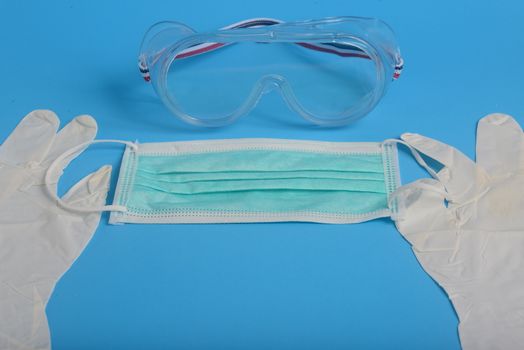 Disposable Hygienic Mask to cover the mouth and nose, transparent plastic laboratory glasses, glove latex hand examination, Protection concept covid-19
