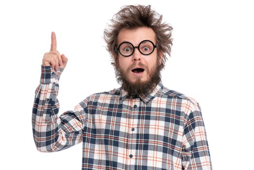 Crazy bearded Man with funny Haircut in eye Glasses, having idea and pointing finger up. Happy Surprised guy in plaid shirt isolated on white. Emotions, business, advertising and signs concept.