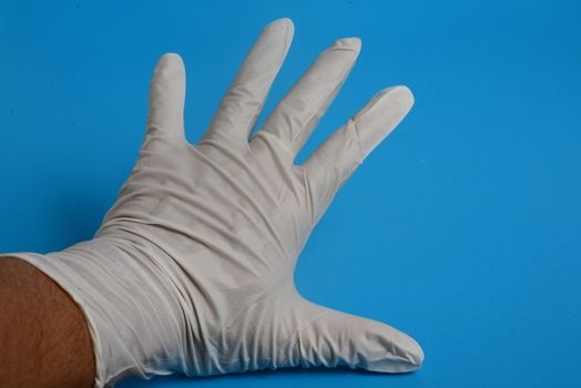 glove latex hand examination on blue background