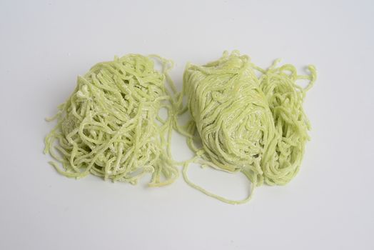 Jade noodle, vegetable noodles, green noodles on white background