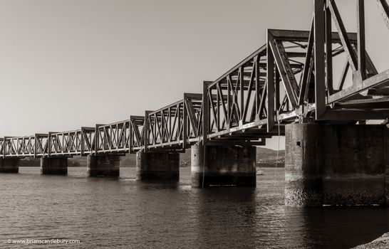 Old-fashioned steel truss railway bridge across Tauranga harbour,  New Zealand.