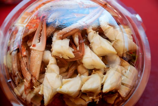 Crab, steamed, pickled sheep's out ready to eat in plastic box