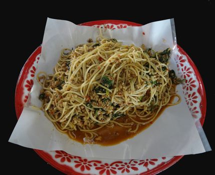 Spicy Stir Fried Spaghetti or Spicy Stir-fried Spaghetti with Chopped Chicken and holy basil on tray, Thai style food