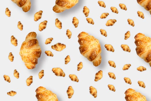 Pattern from croissants isolated on gray background. Bakery pattern with baked croissant.