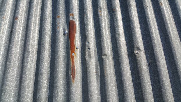 Silver corrugated metal sheet texture background. Steel metal cinc galvanized wave metal sheet for roof and walls.
