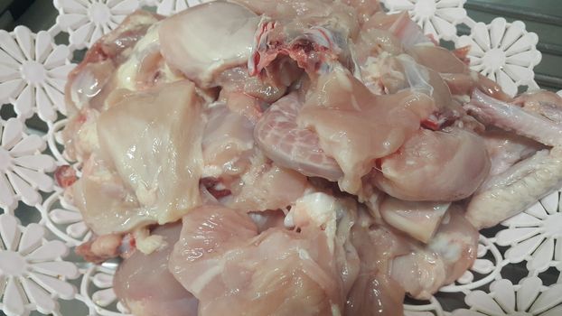 Chicken meat: Close up view of raw, fresh, choped and sliced chicken meat in grocery store use for food and ingredient background. 