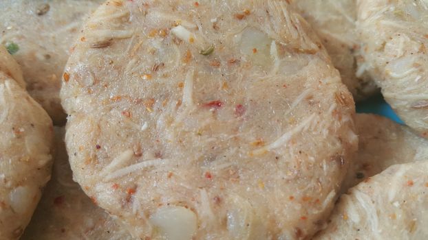 Spicy and tasty uncooked kebab stuffed with minced meat, onion,  alo paste and chana. Asian spicy cuisine.