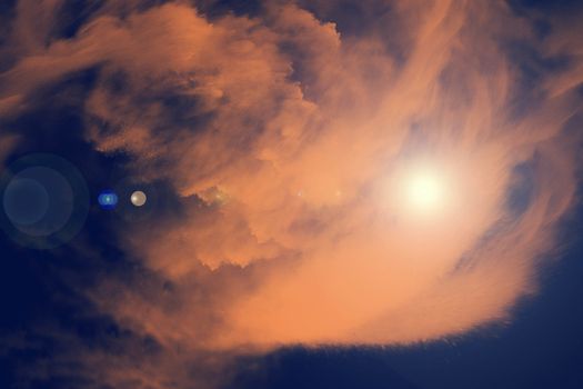 Sky with sunlight in orange shade and dark blue sky background, digital illustration