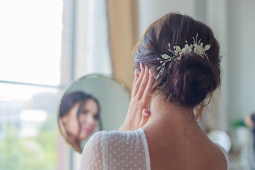 Close-up of a beautyful wedding hairstyle with hair decoration.
