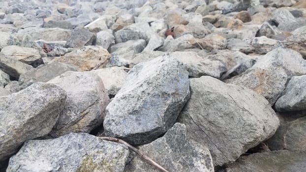 pile of grey rocks or stones or boulders or background