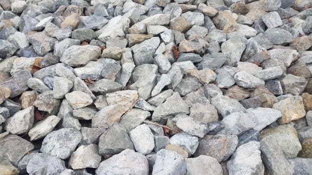 pile of grey rocks or stones or boulders or background