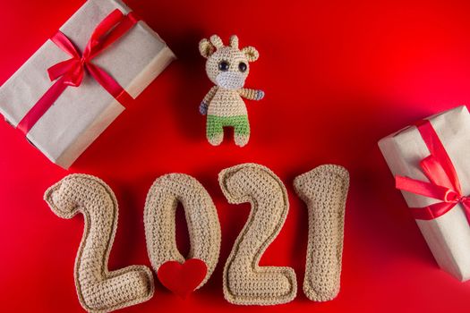 New year background with chroched toy bull symbol of chinese new year 2021 with craft paper gift boxes