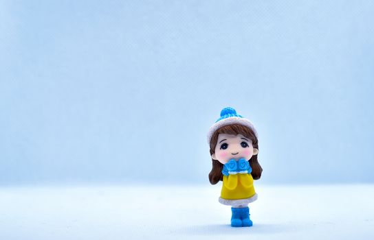 Tourism and travel concept: Miniature little girl standing in isolated background