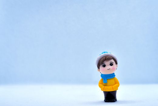 Tourism and travel concept: Miniature little boy standing in isolated background