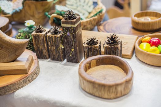 Wooden candlesticks and plates for interior decoration.