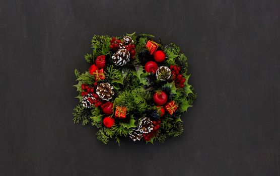 New year background christmas wreath on dark chalk board