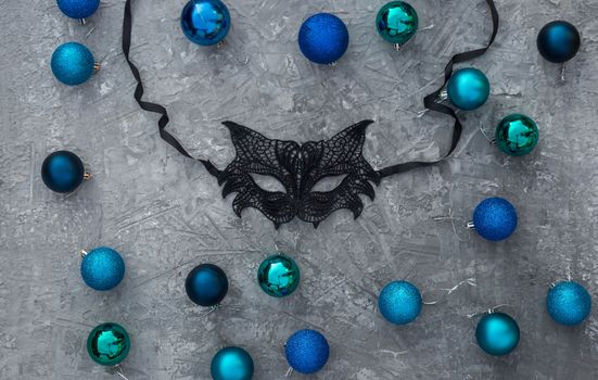 Christmas background with knitted numbers 2021 masquerade lace mask.