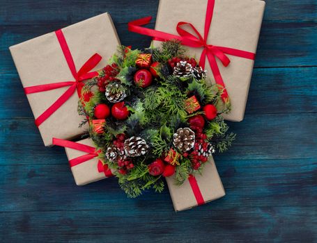 .Christmas background with gifts tied with a red ribbon and decorative wreath