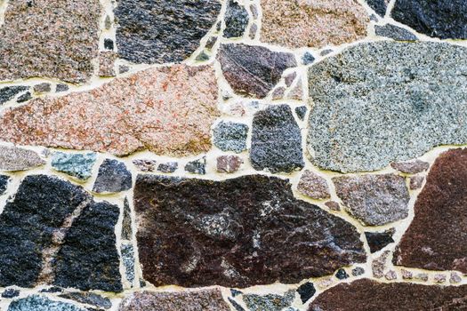 Stone Wall as a Background, Banner, Backdrop, Wallpaper, Poster, or Decorative Design. The Texture of a Stone Wall.