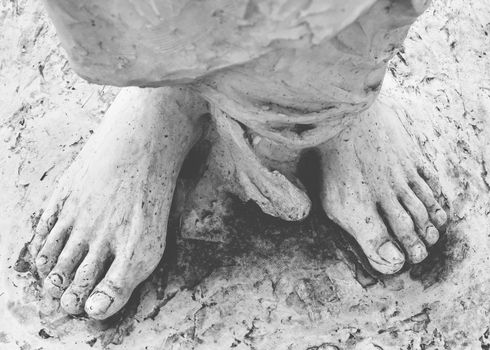 Feet of Christ. Close-up of the feet of Jesus Christ. Top view. Shallow DOF.