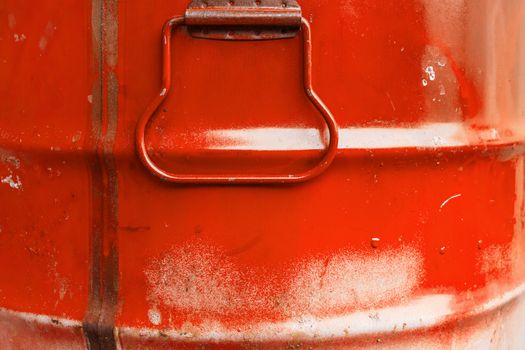 Red color can. Metal can with red paint drips.