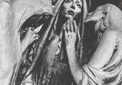Statue of the three desperate Marys. Retro style photo.