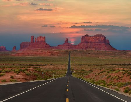 Famous Scenic highway in Monument Valley Tribal Park in Arizona-Utah border, U.S.A. at sunset.