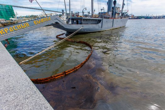 Environmental disaster. Spill of oil products into the sea. Dirty water area of the Golden Horn Bay in Vladivostok