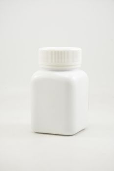 White plastic bottle container with screw cap use to put medicine tablet or capsule