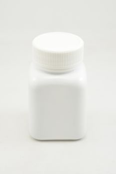 White plastic bottle container with screw cap use to put medicine tablet or capsule