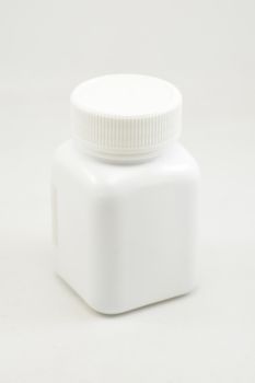 White plastic bottle container with screw cap use to put medicine tablet or capsule