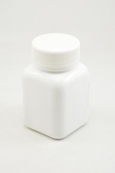 White plastic bottle container with screw cap use to put medicine tablet or capsule