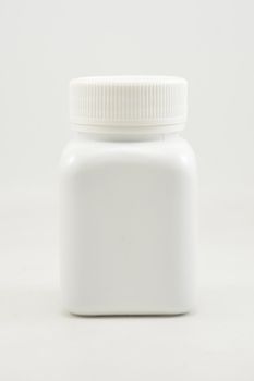 White plastic bottle container with screw cap use to put medicine tablet or capsule