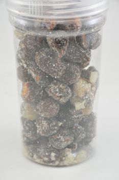 Sweet and spicy tamarinds placed in plastic jar made from Bangkok, Thailand