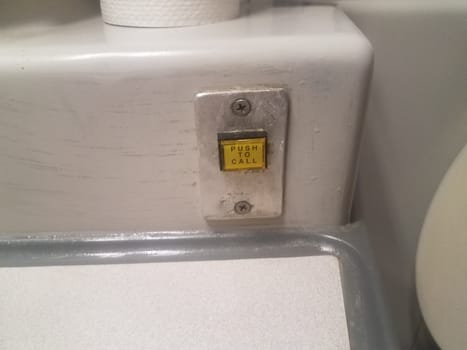 push to call button on toilet in restroom or bathroom