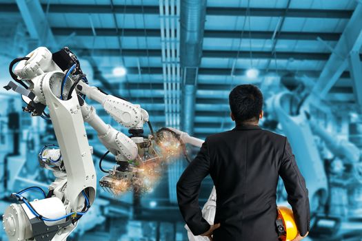 Industrial robot control the engineer in factory
