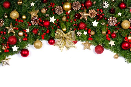 Christmas tree branches and decoration baubles isolated on white background as a border or template for christmas card