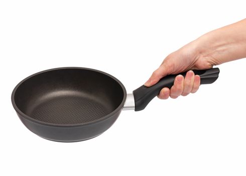 Female hand holding simple new empty Non-stick Frying Pan with black handle, isolated on white background.