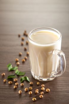 Soy milk on wooden background, Healthy drink.