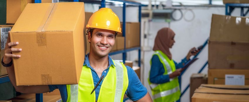 Banner of Idian worker man holding cardboard box and walking with Muslim worker woman scanning bar code and QR code in local warehouse, Partner and colleague working, business reopening after Covid19