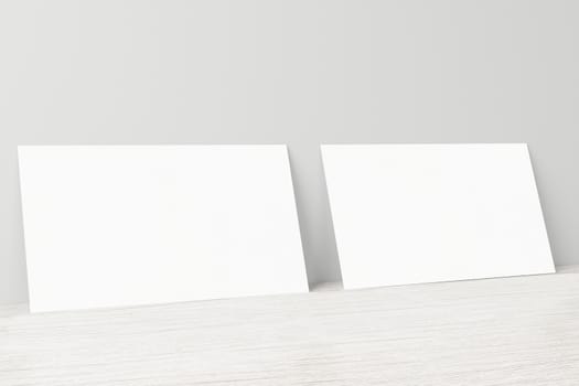 Mockup of two horizontal business cards at white textured background.