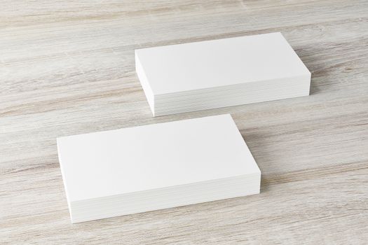 Mockup of two horizontal business cards at white textured background.