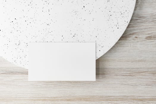 Mockup of two horizontal business cards at white textured background.