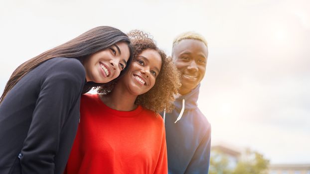 Multi ethnic friends outdoor on photo shooting looking at camera. Diverse group people Afro american asian spending time together Multiracial male female student meeting outdoors for photo