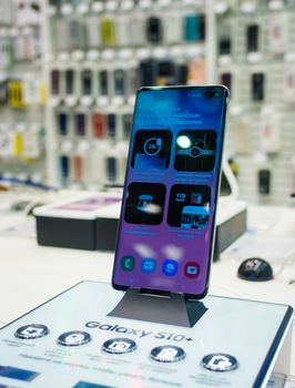 February 28, 2019 Moscow, Russia. The new smartphone from Samsung Galaxy s10+  on the shelf in the gadget store.