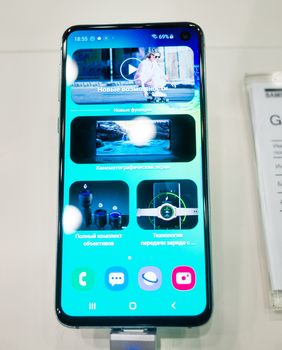 February 28, 2019 Moscow, Russia. The new smartphone from Samsung Galaxy s10e on the shelf in the gadget store.