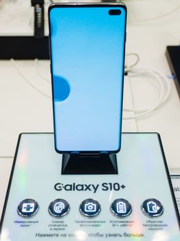 February 28, 2019 Moscow, Russia. The new smartphone from Samsung Galaxy s10+ on the shelf in the gadget store.