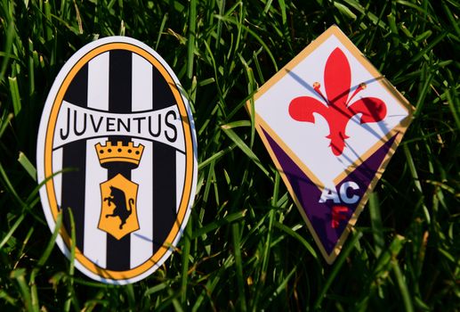September 6, 2019, Turin, Italy. Emblems of Italian football clubs Juventus Turin and Fiorentina Florence on the green grass of the lawn.